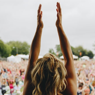 Holmes Place | Woman doing yoga in front of crowd